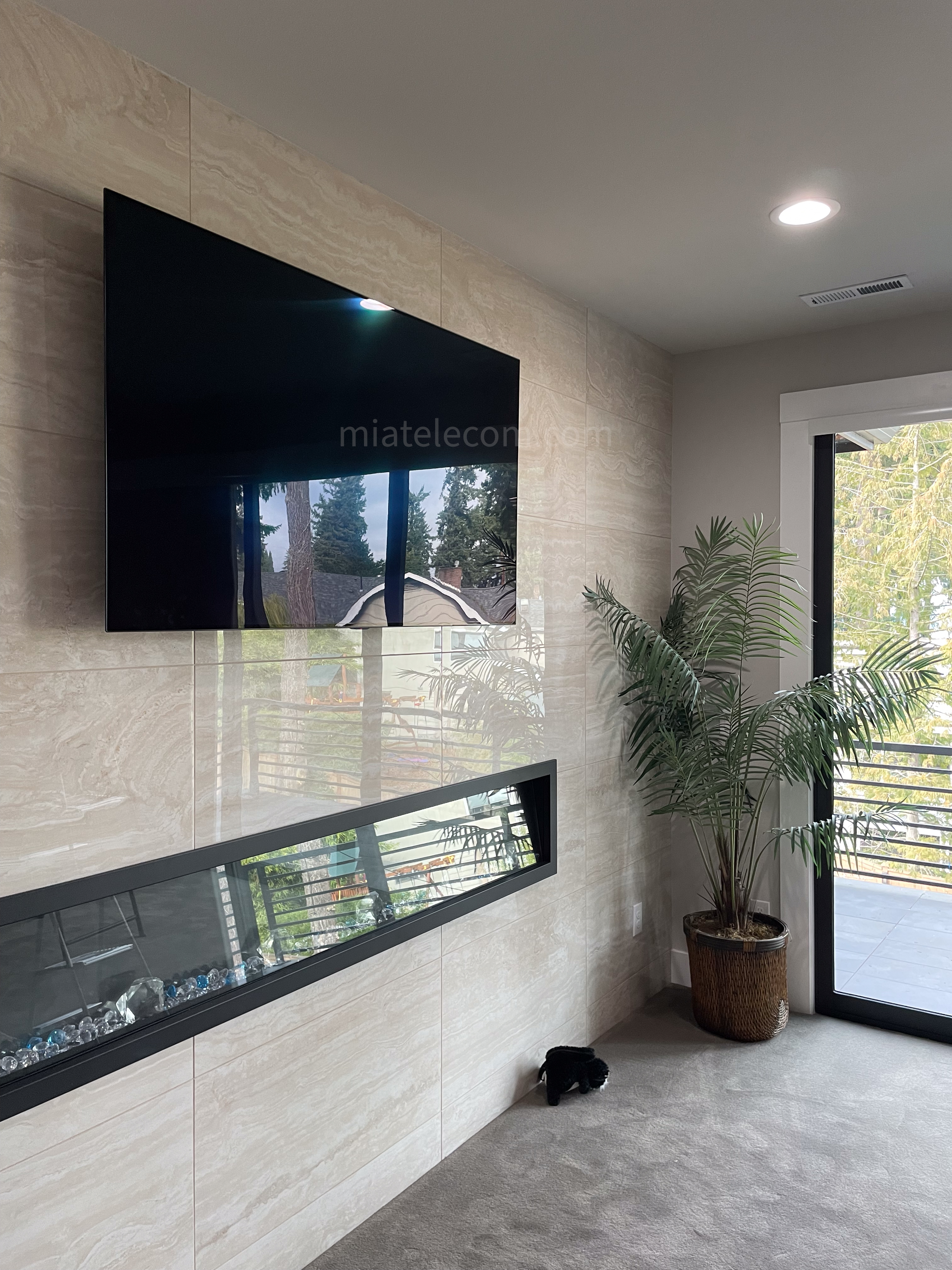 85'' on Marble Wall w/ Electrical Outlet Behind and Sanus Full Motion Mount